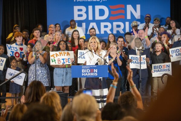 First lady Jill Biden, center, speaks during an event at American Legion Post 111 as she campaigns for her husband, President Joe Biden, Monday, July 8, 2024, in Seminole Heights, Fla. (Dylan Townsend/Tampa Bay Times via AP)