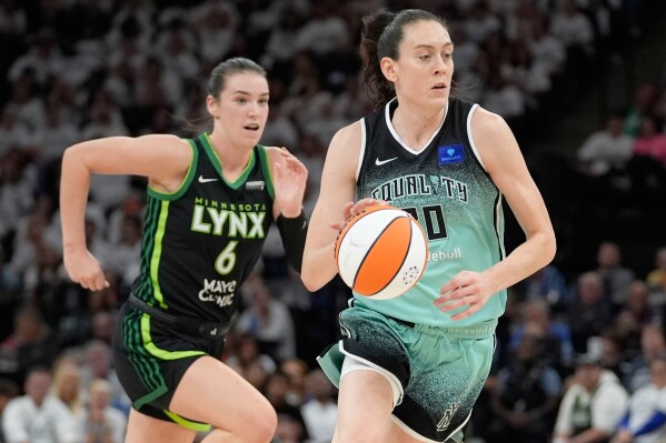 New York Liberty forward Breanna Stewart drives to the basket past Minnesota Lynx forward Bridget Carleton (6) during the first half of Game 4 of a WNBA basketball final playoff series, Friday, Oct. 18, 2024, in Minneapolis. (AP Photo/Abbie Parr, File)