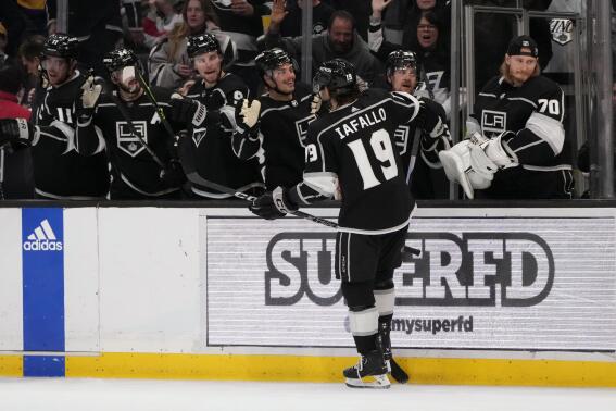 Los Angeles Kings left wing Alex Iafallo (19) celebrates his goal with teammates during the second period of an NHL hockey game against the Montreal Canadiens Thursday, March 2, 2023, in Los Angeles. (AP Photo/Marcio Jose Sanchez)