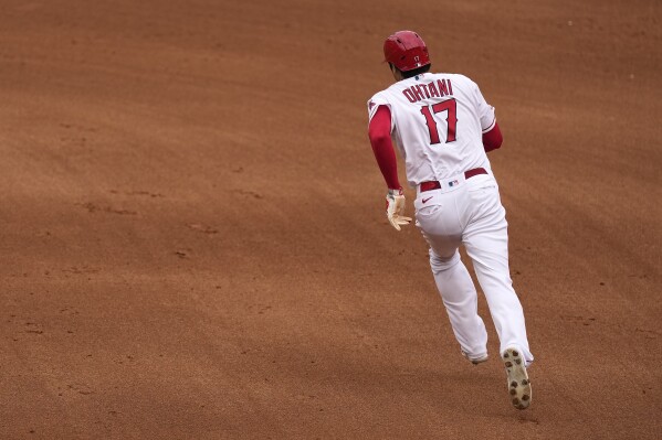 Los Angeles Angels' Shohei Ohtani heads to second on his way to third on a single by Mickey Moniak during the fifth inning of a baseball game against the Pittsburgh Pirates Sunday, July 23, 2023, in Anaheim, Calif. (AP Photo/Mark J. Terrill)