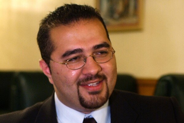 FILE - Mohamed Khairullah, a Borough Council member in Prospect Park, N.J., who was appointed mayor, pauses during an interview in Paterson, N.J., July 30, 2004. A lawsuit filed by an Islamic civil rights group challenges the constitutionality of the government's terror watchlist and says Muslims face negative repercussions even after they are able to clear their name off the list. One of the plaintiffs in the case is Mohamed Khairullah. He thought he had been cleared from the list in 2021, only to find that the Secret Service would not let him attend a White House event earlier this year. (AP Photo/Mike Derer, File)