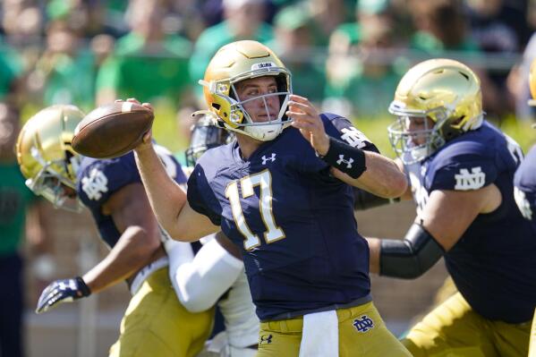 Notre Dame quarterback Jack Coan (17) throws against Purdue during the first half of an NCAA college football game in South Bend, Ind., Saturday, Sept. 18, 2021. (AP Photo/Michael Conroy)