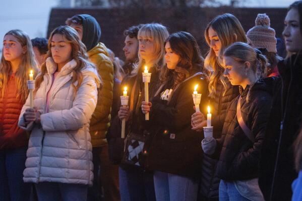 FILE - Boise State University students, along with people who knew the four University of Idaho students who were found killed in Moscow, Idaho, days earlier, pay their respects at a vigil held in front of a statue on the Boise State campus, Thursday, Nov. 17, 2022, in Boise, Idaho. The arrest of Bryan Christopher Kohberger in the Nov. 13, 2022 fatal stabbings of four University of Idaho students has brought relief to the small college town of Moscow, Idaho.(Sarah A. Miller/Idaho Statesman via AP, File)