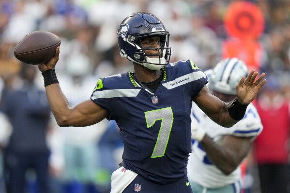 Seattle Seahawks quarterback Geno Smith passes against the Dallas Cowboys during the first half of a preseason NFL football game Saturday, Aug. 19, 2023, in Seattle. (AP Photo/Stephen Brashear)