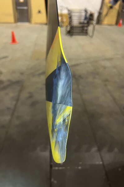 This image from video released by the U.S. Air Force, shows a damaged propeller from a U.S. drone, July 23, 2023. A Russian fighter jet flew within a few meters of a U.S. drone over Syria and fired flares at it, striking the American aircraft and damaging it, the U.S. military said Tuesday, the latest in a string of aggressive intercepts by Russia in the region. Despite the damage, the aircraft was able to return to its home base. (U.S. Air Force via AP)