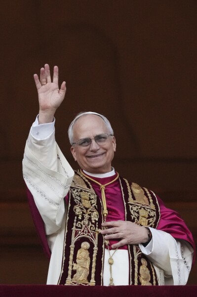 Newly elected Pope Leo XIV appears at the balcony of St. Peter's Basilica at the Vatican, Thursday, May 8, 2025. (AP Photo/Alessandra Tarantino)