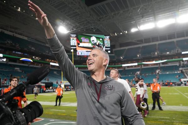 Florida State head coach Mike Norvell waves to fans after an NCAA college football game against Miami, Saturday, Nov. 5, 2022, in Miami Gardens, Fla. Florida State won 45-3. (AP Photo/Lynne Sladky)