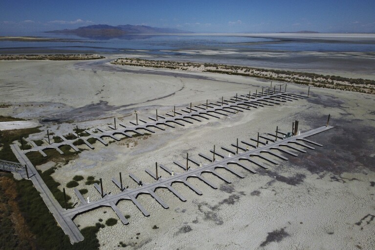 Empty docks are visible at the Antelope Island Marina due to record low water levels on Aug. 31, 2022, on the Great Salt Lake, near Syracuse, Utah. (AP Photo/Rick Bowmer)