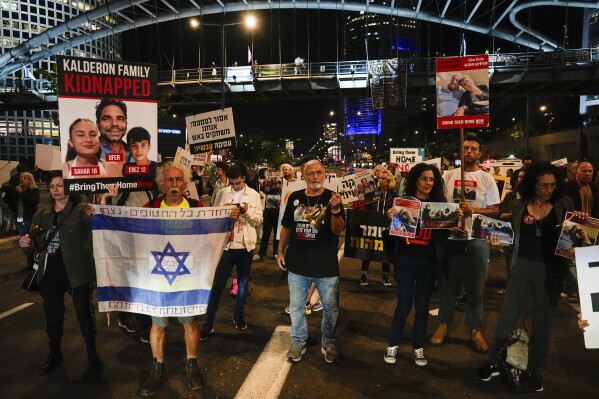 Families and friends of about 240 hostages held by Hamas in Gaza call for Israeli Prime Minister Benjamin Netanyahu to bring them home during a demonstration in Tel Aviv, Israel Tuesday, Nov. 21, 2023.  (AP Photo/Ariel Schalit)