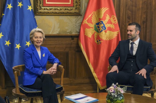 European Commission President Ursula von der Leyen, left, talks with Montenegro's new Prime Minister Milojko Spajic in Podgorica, the capital of Montenegro, Tuesday, October 31, 2023. Von der Leyen is making an official visit a day in Montenegro.  (AP Photo/Risto Bozovic)