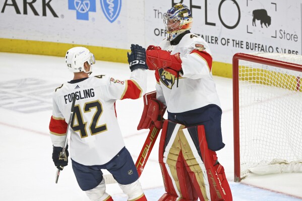 Florida Panthers goaltender Anthony Stolarz (41) celebrates with defenseman Gustav Forsling (42) after the team's win over the Buffalo Sabres in an NHL hockey game Thursday, Feb. 15, 2024, in Buffalo, N.Y. (AP Photo/Jeffrey T. Barnes)