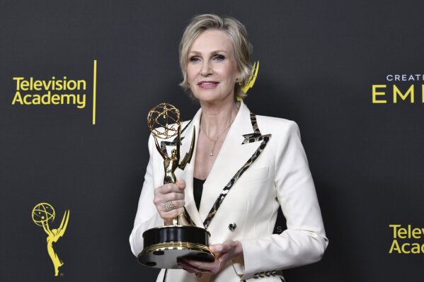 CORRECTS THE DATE TO SUNDAY, SEPT. 15 -  Jane Lynch poses in the press room with the award for outstanding guest actress in a comedy series for "The Marvelous Mrs. Maisel" on night two of the Creative Arts Emmy Awards on Sunday, Sept. 15, 2019, at the Microsoft Theater in Los Angeles. (Photo by Richard Shotwell/Invision/AP)