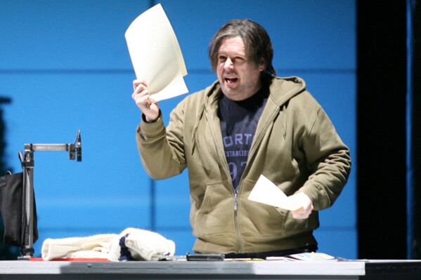 FILE - Tenor Stephen Gould performs as Peter Grimes during a rehearsal for the opera "Peter Grimes", written by Benjamin Britten, at the Saxony State Opera in Dresden, Germany on Feb. 5, 2007. Gould says he has been diagnosed with incurable bile duct cancer. Gould withdrew this summer from the Bayreuth Festival in Germany, where he was to have sung the title roles in “Tannhäuser” and “Tristan und Isolde” and Siegfried in “Götterdämmerung.” (AP Photo/Matthias Rietschel, File)