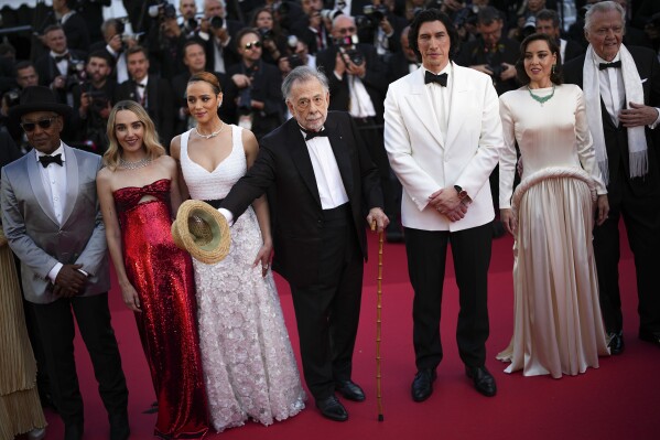 Giancarlo Esposito, from left, Chloe Fineman, Nathalie Emmanuel, director Francis Ford Coppola, Adam Driver, Aubrey Plaza, and Jon Voight pose for photographers upon arrival at the premiere of the film 'Megalopolis' at the 77th international film festival, Cannes, southern France, Thursday, May 16, 2024. (Photo by Daniel Cole/Invision/Ǻ)