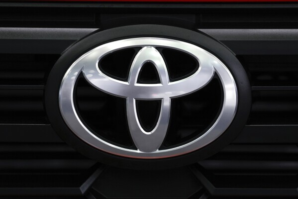 FILE - A Toyota logo is shown at the North American International Auto Show in Detroit, Sept. 13, 2023. Toyota said Wednesday, July 10, 2024 it’s investing in Ionna, teaming with seven other automakers to support the company’s implementation of its charging network for battery electric vehicles across North America. (AP Photo/Paul Sancya, file)