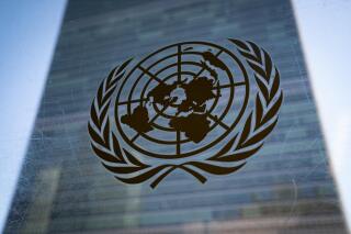 FILE - The symbol of the United Nations is displayed outside the Secretariat Building, Feb. 28, 2022, at United Nations Headquarters. (AP Photo/John Minchillo, File)