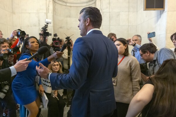 Pete Hegseth, President-elect Donald Trump's pick for Secretary of Defense, speaks with reporters after meeting with senators on Capitol Hill, Thursday, Nov. 21, 2024, in Washington. (AP Photo/Mark Schiefelbein)