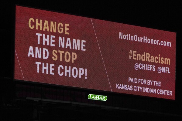 FILE - A billboard calling for a name change and an end to the Kansas City Chiefs "chop" stands along Interstate 70 in Kansas City, Mo., Wednesday, Feb. 3, 2021. (AP Photo/Orlin Wagner, File)