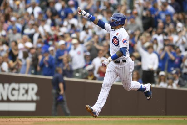 Chicago Cubs' Javier Baez celebrates while rounding the bases after hitting a two-run home run during the third inning of a baseball game against the San Diego Padres on Monday, May 31, 2021, in Chicago. (AP Photo/Paul Beaty)