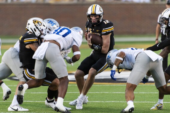 Missouri quarterback Brady Cook (12) runs the ball during the second quarter of an NCAA college football game against Middle Tennessee, Saturday, Sept. 9, 2023, in Columbia, Mo. (AP Photo/L.G. Patterson)
