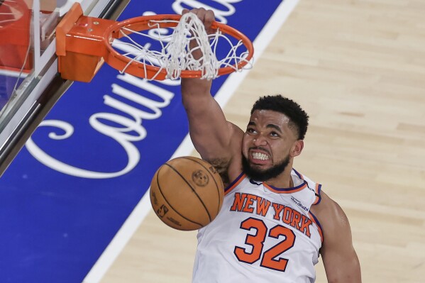 New York Knicks center Karl-Anthony Towns (32) scores against the Indiana Pacers during the fourth quarter of Game 5 of the NBA basketball Eastern Conference final, Thursday, May 29, 2025, in New York. (AP Photo/Adam Hunger)