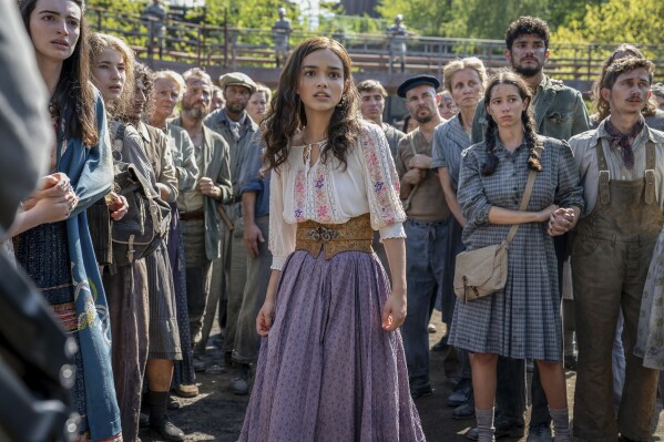 This image released by Lionsgate shows Rachel Zegler, center, in a scene from "The Hunger Games: The Ballad of Songbirds and Snakes." (Lionsgate via AP)