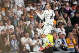 Real Madrid's Luka Modric celebrates after scoring the opening goal during the Spanish league match against Girona, Sunday, Feb. 23, 2025. (AP Photo/Manu Fernandez)
