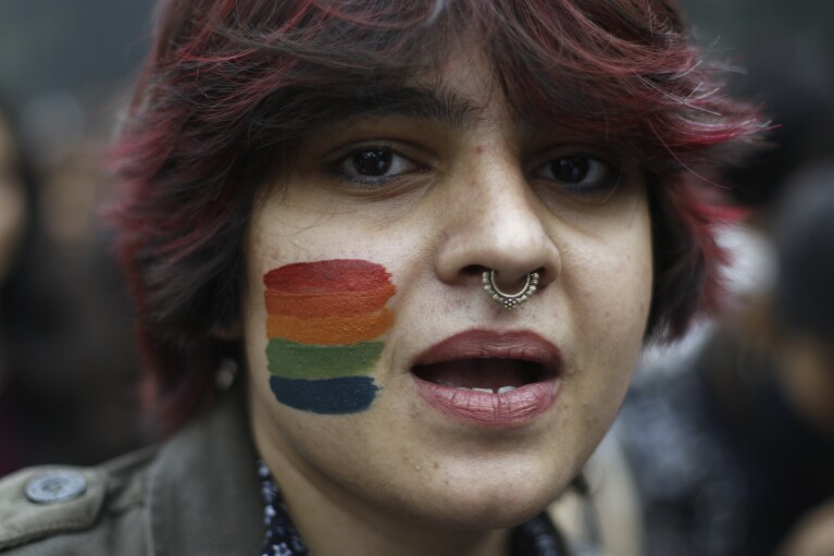 A participant of the Delhi Queer Pride Parade poses for a photograph during the march in New Delhi, India, Sunday, Nov. 26, 2023. This annual event comes as India's top court refused to legalize same-sex marriages in an October ruling that disappointed campaigners for LGBTQ+ rights in the world's most populous country. (AP Photo/Dinesh Joshi)