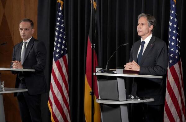 US Secretary of State, Antony Blinken, right, and German Foreign Minister Heiko Maas, left, address the media during a joint press conference after a meeting at the Ramstein U.S. Air Base in Ramstein, Germany, Wednesday, Sept. 8, 2021. The largest American military community overseas houses thousands Afghan evacuees in a tent city at the airbase. (AP Photo/Michael Probst)