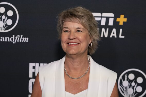 Iowa women's NCAA college basketball head coach Lisa Bluder arrives on the Red Carpet before the world premiere and screening of Episode 1 of the upcoming ESPN+ Original Series Full Court Press, Monday, May 6, 2024, in Indianapolis. (AP Photo/Darron Cummings)