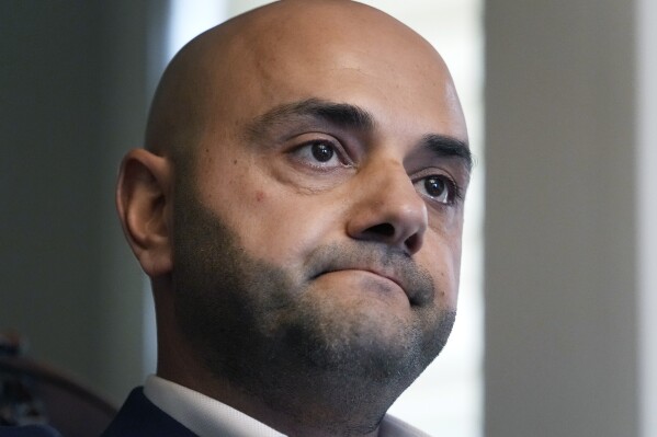 Assad Turfe, a Lebanese American and the deputy executive of Wayne County, recalls the detainment of his wife, during an interview, Oct. 23, 2024 in Dearborn, Mich. Turfe is among the few Arab American leaders in Michigan to have endorsed presidential candidate Kamala Harris. (AP Photo/Carlos Osorio)