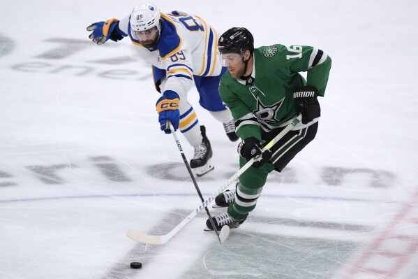 Dallas Stars center Joe Pavelski (16) skates with the puck past Buffalo Sabres right wing Alex Tuch (89) during the third period of an NHL hockey game in Dallas, Tuesday, April 9, 2024. (AP Photo/LM Otero)
