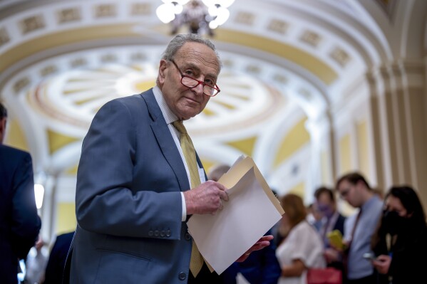 Senate Majority Leader Chuck Schumer, D-N.Y., speaks to reporters at the Capitol in Washington, Tuesday, Dec. 12, 2023. Senators met earlier with Ukrainian President Volodymyr Zelenskyy as he issued a plea for Congress to break its deadlock and approve continued wartime funding for Ukraine, Tuesday, Dec. 12, 2023. (AP Photo/J. Scott Applewhite)