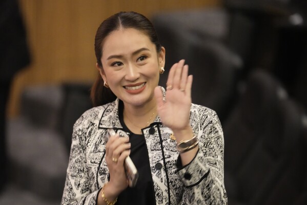 FILE - Leader of Pheu Thai Party, Paetongtarn Shinawatra, daughter of Thailand's former Prime Minister Thaksin Shinawatra, waves before a press conference in Bangkok, Thailand, Thursday, Aug. 15, 2024. (AP Photo/Sakchai Lalit, File)