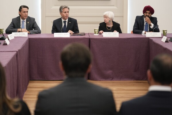 FILE - Secretary of State Antony Blinken, second from left, participates in global infrastructure and investment forum with Amos Hochstein, left, senior advisor to the president on energy and and investment, Janet Yellen, second from right, United States Secretary of Treasury, and Ajay Banga, right, World Bank president, in New York, Sept. 21, 2023. Economic crises are rippling through the countries bordering Israel. That raises the possibility of a chain reaction from the war against Hamas that further worsens the financial health and political stability of Egypt, Jordan and Lebanon and creates problems well beyond.(AP Photo/Seth Wenig, Pool)