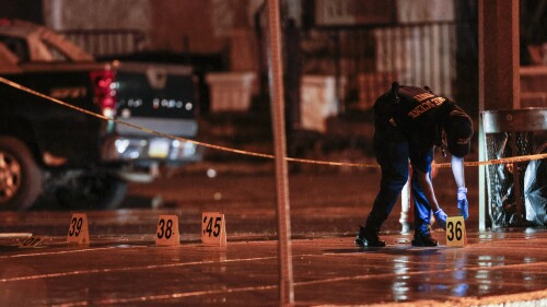 Police on the scene of a shooting Monday, July 3, 2023 in Philadelphia. Police say a gunman in a bulletproof vest has opened fire on the streets of Philadelphia, killing several people and wounding two boys before he surrendered to responding officers. (Steven M. Falk/The Philadelphia Inquirer via AP)