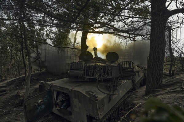 A Ukrainian self-propelled artillery system fires towards the Russian positions at the front line near Bakhmut, Donetsk region, Ukraine, Friday, Sept. 1, 2023. (AP Photo/Libkos)