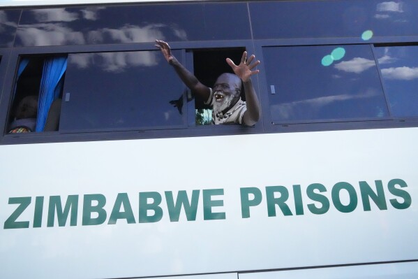 An elderly freed prisoner celebrates after he was released from Harare Central Prison in Harare, Friday, May, 19, 2023. Zimbabwe has begun releasing more than 4,000 prisoners under a presidential amnesty that authorities say will help ease congestion in some overcrowded jails. About 800 prisoners were on Friday released from Harare Central Prison and Chikurubi Maximum Prison in the capital, Harare, according to Zimbabwe Prisons and Correctional Services. (AP Photo/Tsvangirayi Mukwazhi)
