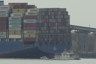 FILE - A container ship rests against wreckage of the Francis Scott Key Bridge on Tuesday, March 26, 2024, as seen from Dundalk, Md. Social media users are falsely claiming that Senate Minority Leader Mitch McConnell's sister-in-law, who died in February, had been the CEO of the company that owns the ship. (File, AP Photo/Matt Rourke)