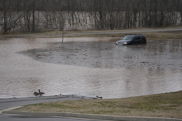 A vehicle is in the floods along the Red River, Sunday February 16, 2025, in Clarksville, Tenn. (AP photo / George Walker IV)