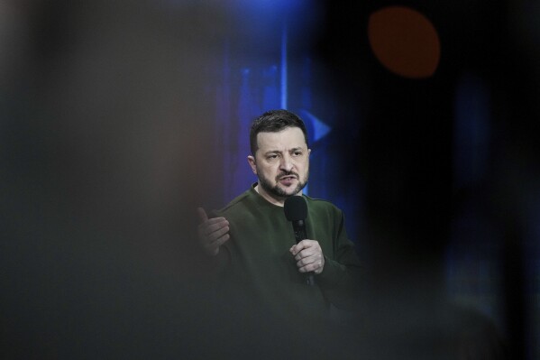 Ukrainian President Volodymyr Zelenskyy answers media questions during his press conference in Kyiv, Ukraine, Sunday Feb. 25, 2024. (AP Photo/Evgeniy Maloletka)