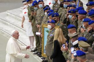 Pope Francis meets a group of Italian army officers at the end of his weekly general audience in the Pope Paul VI hall at the Vatican, Wednesday, Oct. 6, 2021. (AP Photo/Alessandra Tarantino)