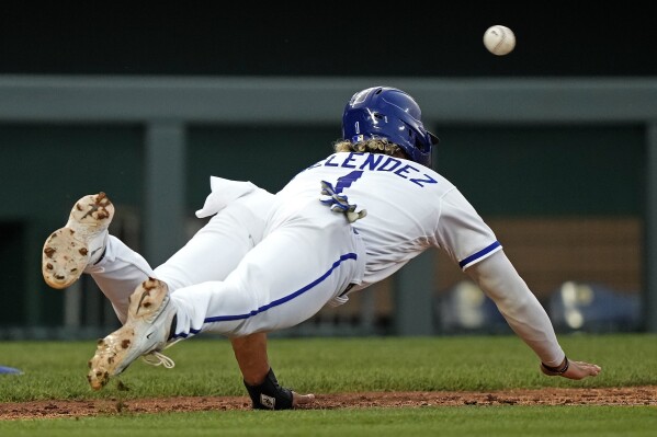 Detroit Tigers' Matt Vierling slides home after tagging on fly