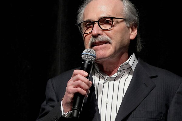 FILE - In this Jan. 31, 2014 photo, David Pecker, chairman and CEO of American Media, addresses those attending the Shape & Men's Fitness Super Bowl Party in New York. In an announcement Friday, Aug. 21, 2020, Pecker is stepping down as CEO of the National Enquirer’s parent, ending a reign that saw the company entangled in a campaign-finance scandal that sent President Donald Trump’s personal lawyer to jail. Pecker's American Media is being taken over by Accelerate360, a Georgia-based logistics company. (Marion Curtis via AP, File)