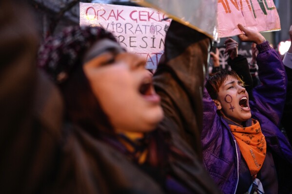 Demonstrators chant slogans during a march to mark International Women's Day in Istanbul, Turkey, Friday, March 8, 2024. (AP Photo/Emrah Gurel)