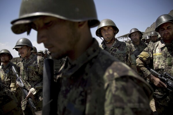 FILE - Afghan Army soldiers gather at a training facility on the outskirts of Kabul, Afghanistan, May 8, 2013. (AP Photo/Anja Niedringhaus, File)