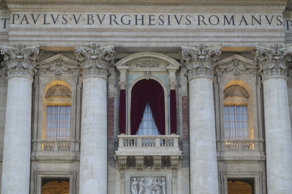 A view of the balcony of St. Peter's Basilica during the cardinals' conclave to elect a new pope, at the Vatican, Wednesday, May 7, 2025. (AP Photo/Alessandra Tarantino)