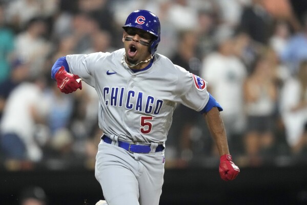 Chicago Cubs' Christopher Morel celebrates down the first base line his two-run single off Chicago White Sox starting pitcher Lance Lynn during the fifth inning of a baseball game, Wednesday, July 26, 2023, in Chicago. (AP Photo/Charles Rex Arbogast)