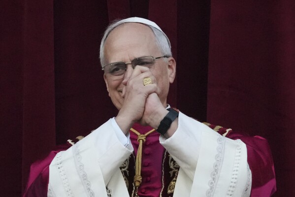 Newly elected Pope Leo XIV appears at the balcony of St. Peter's Basilica at the Vatican, Thursday, May 8, 2025. (AP Photo/Alessandra Tarantino)