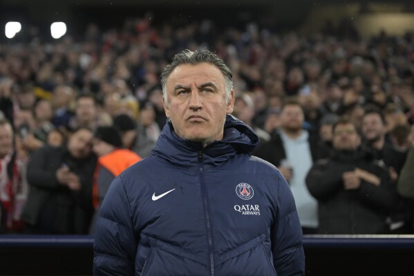 FILE - PSG's head coach Christophe Galtier stands prior to the start of the Champions League round of 16 second leg soccer match between Bayern Munich and Paris Saint Germain at the Allianz Arena in Munich, Germany, on March 8, 2023. Galtier stood trial on Friday Dec. 15, 2023 for accusations of racism during his time as coach of his former club Nice. (AP Photo/Andreas Schaad, File)
